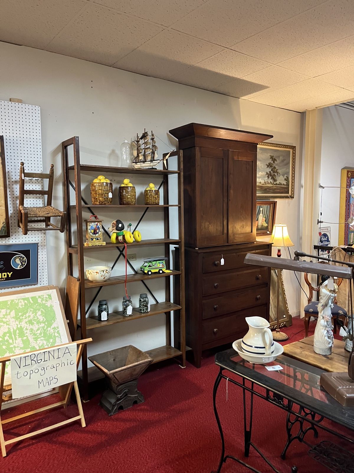 Antique cabinet with shelves of glassware