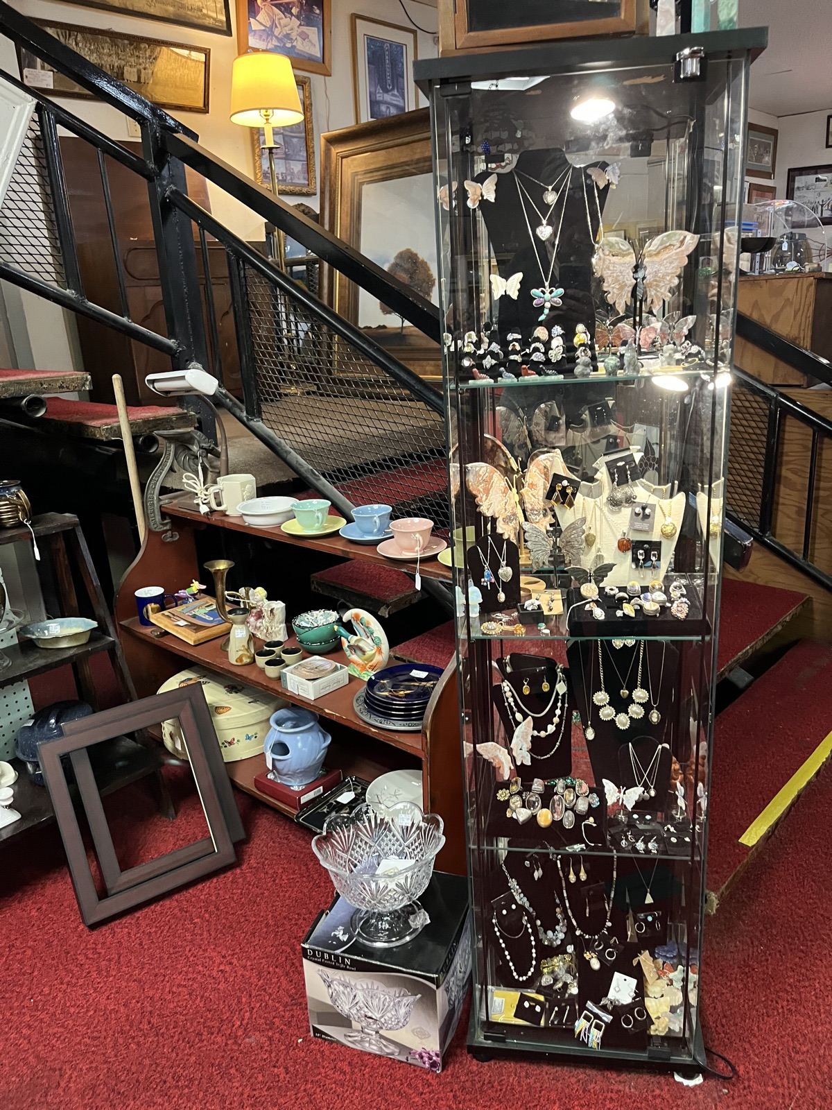 Glass display case of vintage jewelry