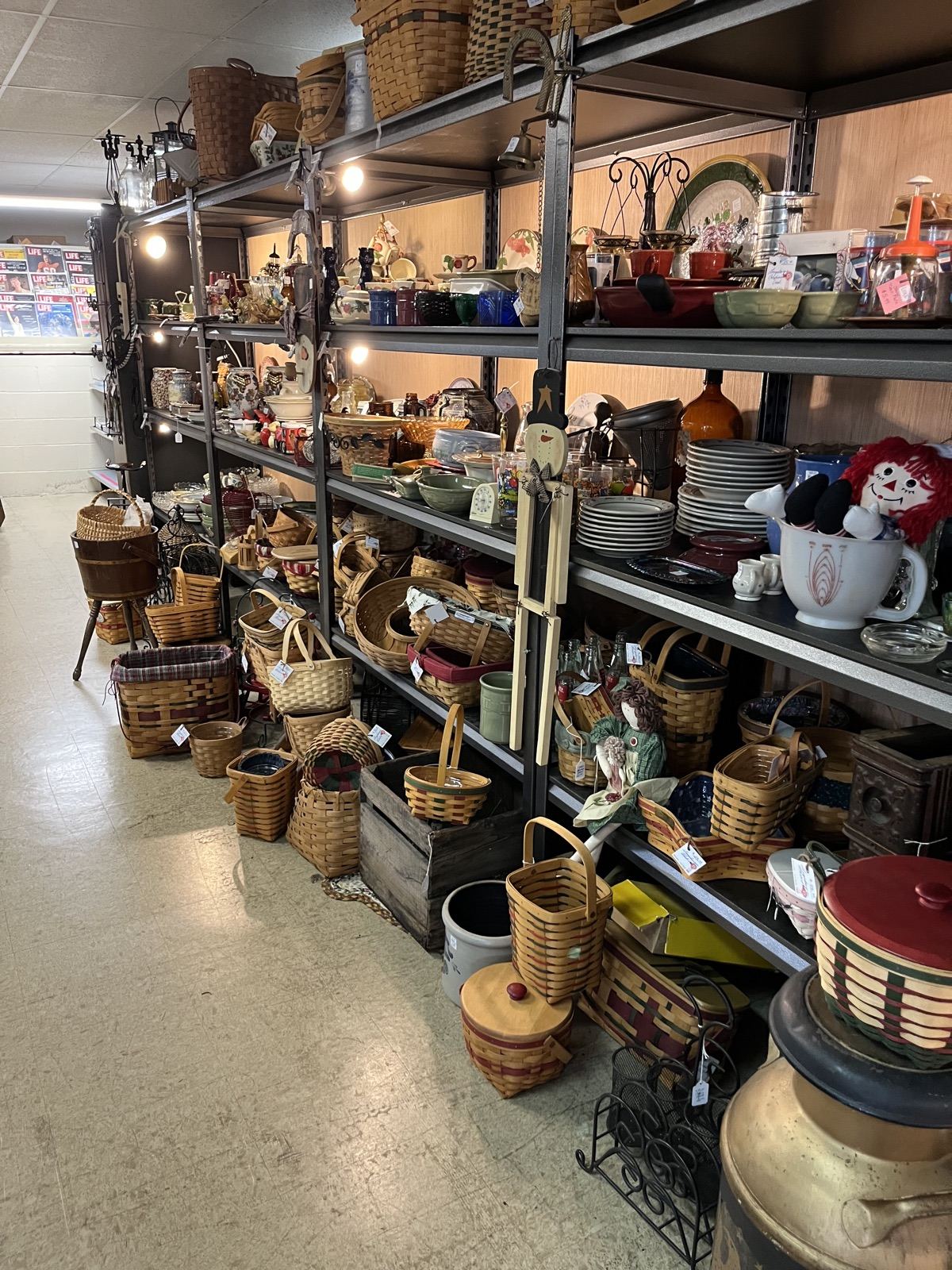 Shelves of baskets, crocks and country decor